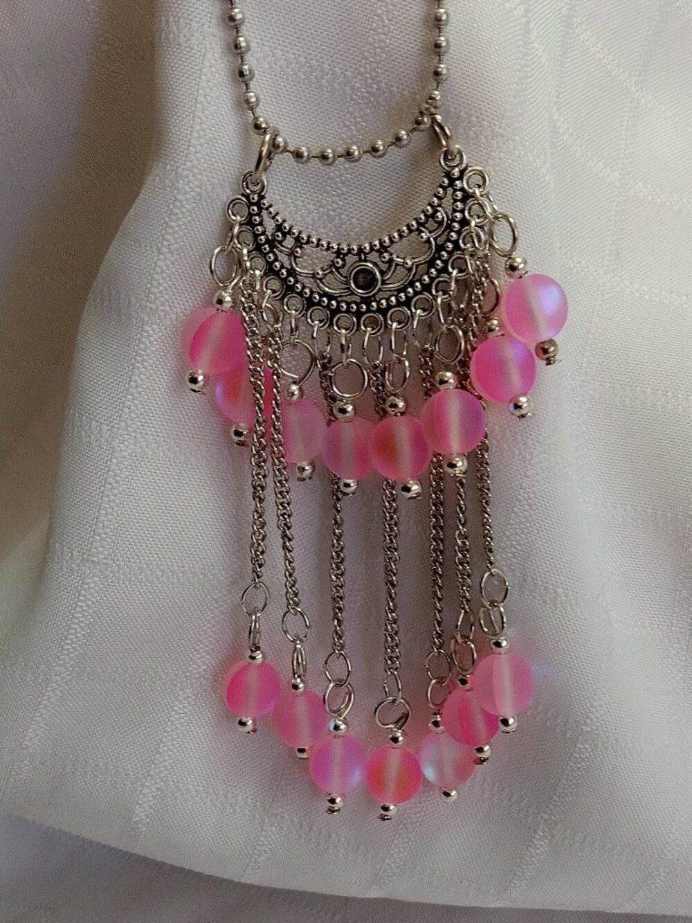 Exquisite handmade necklace featuring a half-moon-shaped Tibetan silver charm